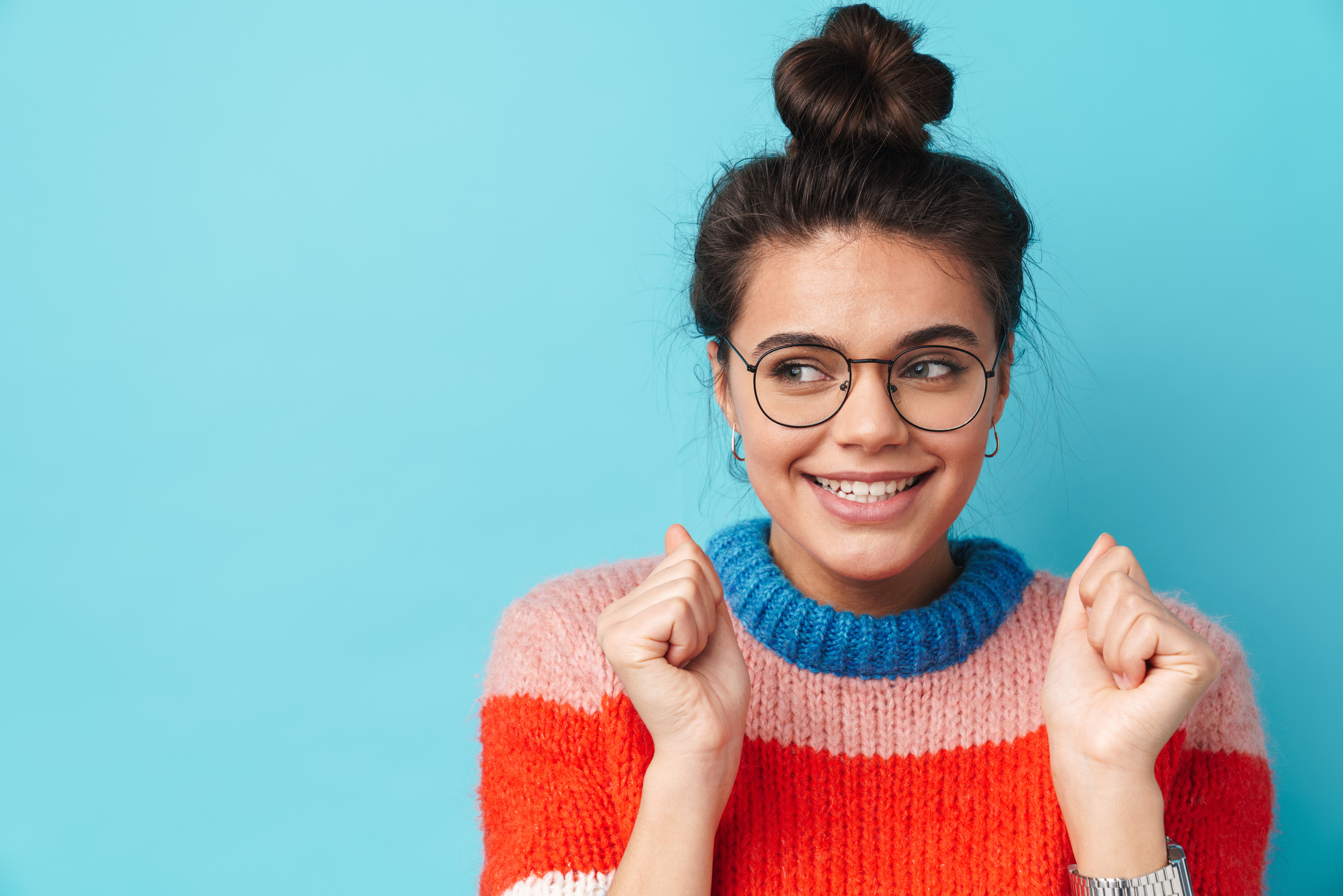 Happy Woman in Multicolored Sweater and Eyeglasses